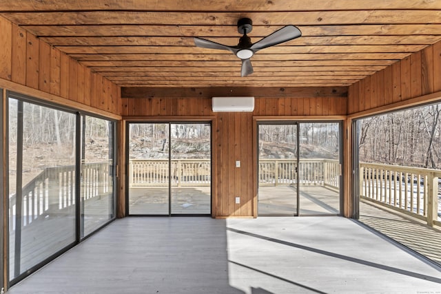 unfurnished sunroom featuring wooden ceiling, an AC wall unit, and ceiling fan