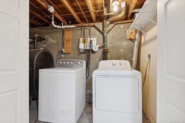 clothes washing area with washing machine and clothes dryer