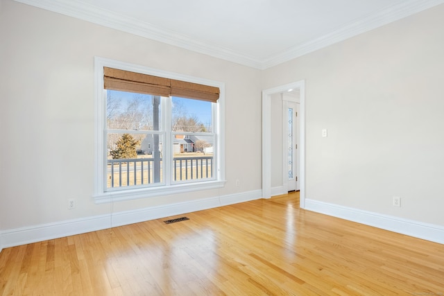 unfurnished room featuring crown molding and wood-type flooring