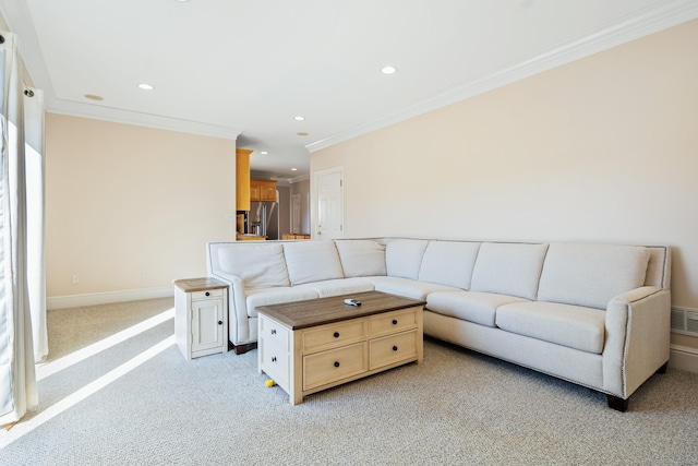 carpeted living room with ornamental molding