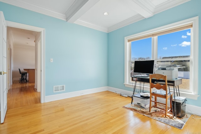 office space featuring hardwood / wood-style flooring, crown molding, and beam ceiling