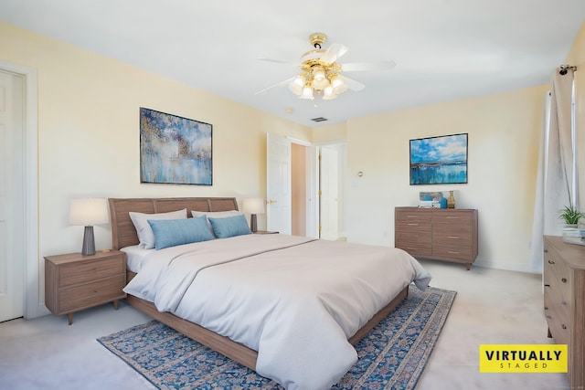 bedroom featuring ceiling fan and light carpet