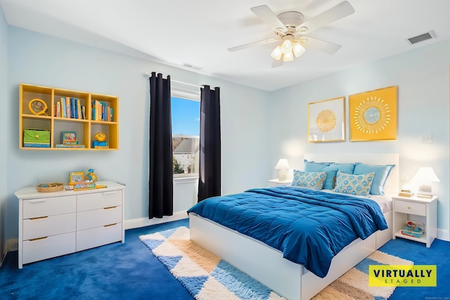 bedroom with ceiling fan and dark colored carpet