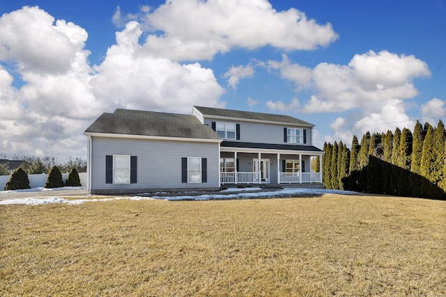 view of front facade featuring a front lawn and covered porch