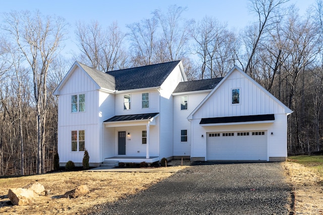 modern farmhouse featuring a garage and covered porch