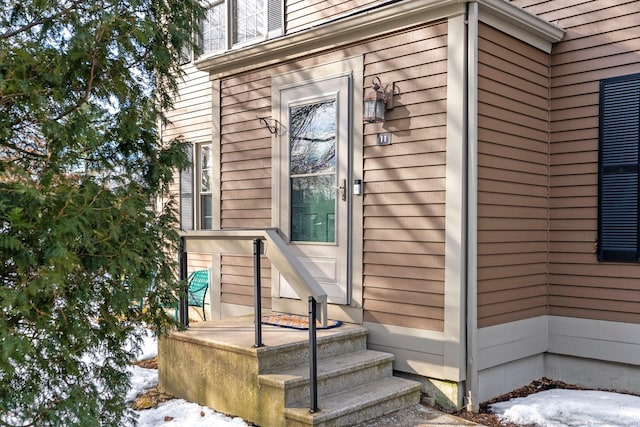 view of snow covered property entrance