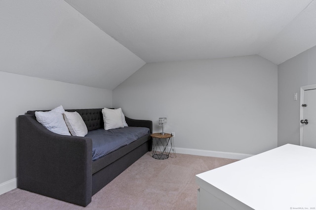 living room with light carpet, baseboards, and vaulted ceiling