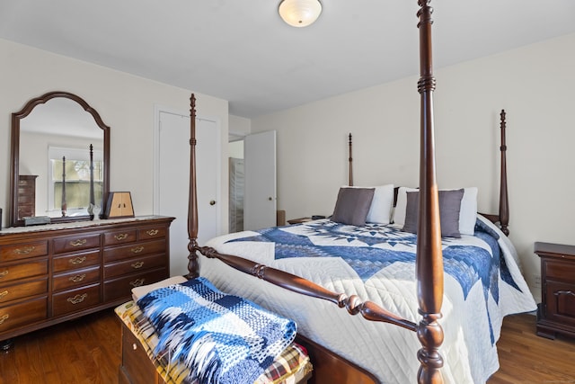 bedroom with dark wood-style floors