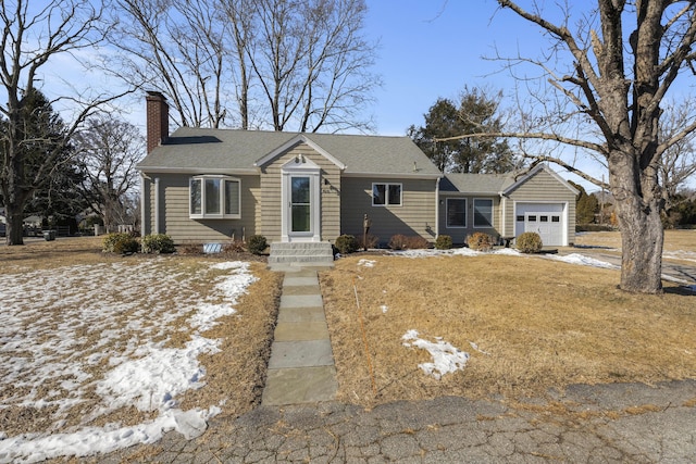 view of front of house with a garage, roof with shingles, and a chimney