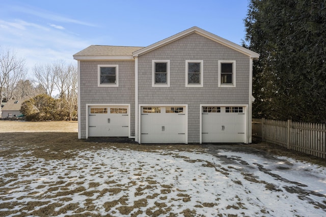 garage with a garage and fence