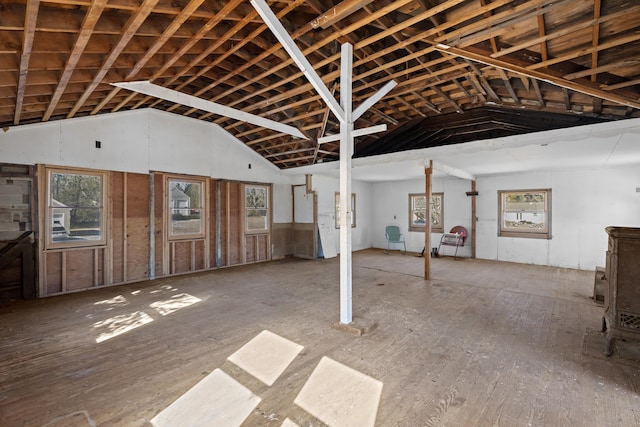 miscellaneous room with lofted ceiling