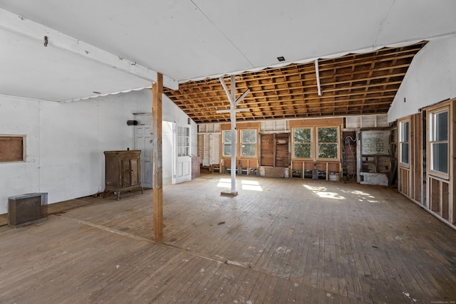 misc room featuring vaulted ceiling and hardwood / wood-style flooring