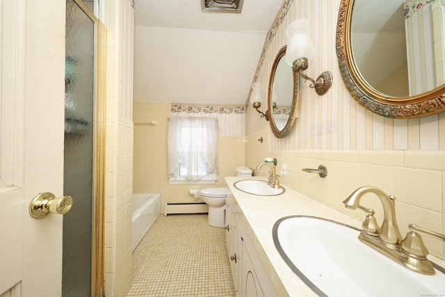 bathroom with a baseboard radiator, tile walls, tile patterned flooring, vanity, and toilet