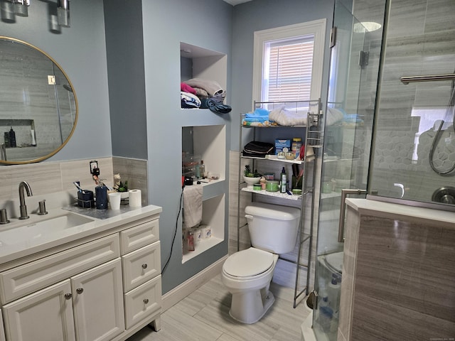 bathroom with walk in shower, vanity, toilet, and backsplash