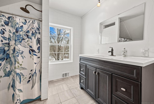 bathroom with tile patterned floors, vanity, and a shower with curtain