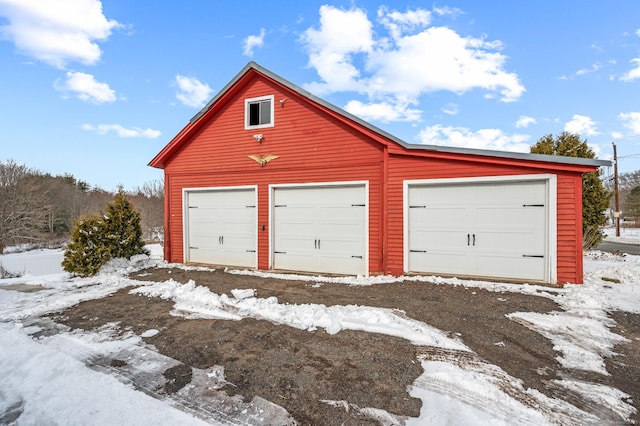 view of snow covered garage