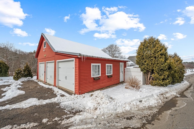 view of snow covered garage