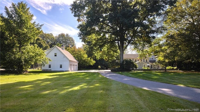 view of yard featuring a garage