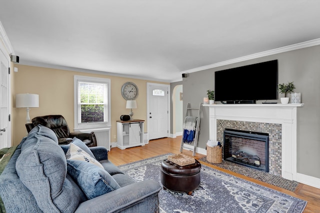 1379 Old N Colony Rd, Meriden, CT 06450 - living room featuring a fireplace, wood finished floors, and crown molding