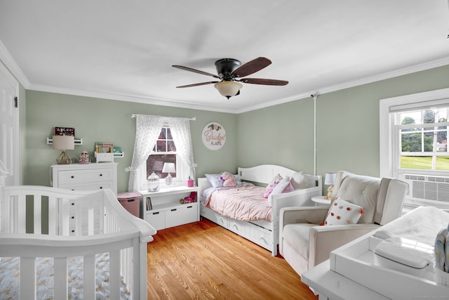 1379 Old N Colony Rd, Meriden, CT 06450 - bedroom featuring ornamental molding, multiple windows, light wood finished floors, cooling unit, and a ceiling fan