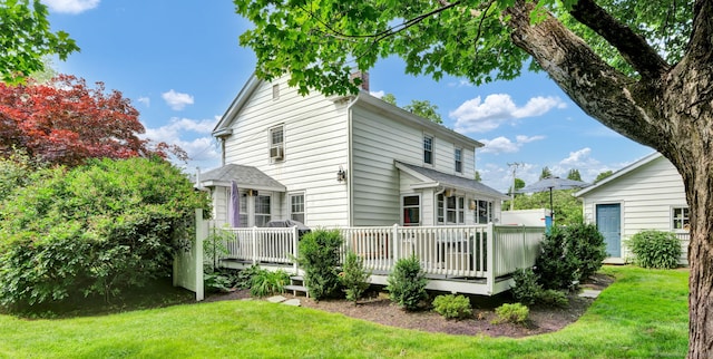 1379 Old N Colony Rd, Meriden, CT 06450 - rear view of house featuring a yard, a wooden deck, and a chimney