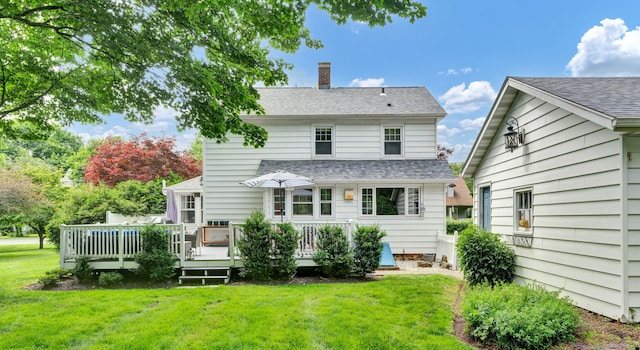 1379 Old N Colony Rd, Meriden, CT 06450 - rear view of property with a chimney, a yard, a deck, and roof with shingles