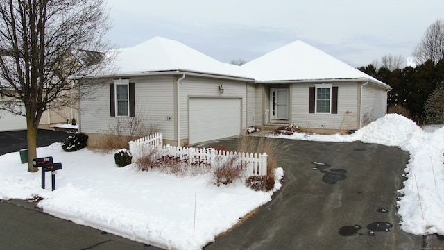 single story home featuring a garage