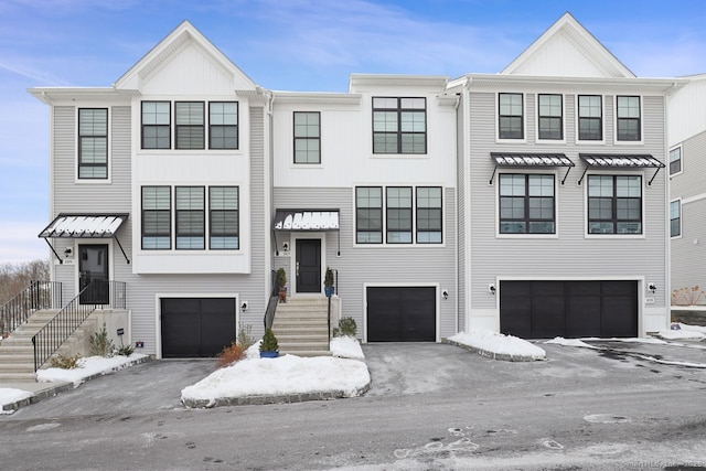 townhome / multi-family property featuring a garage