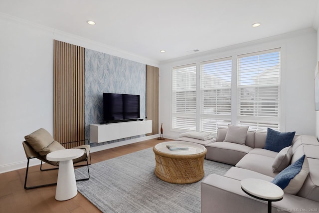 living room featuring crown molding and light wood-type flooring