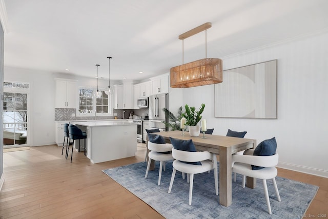 dining room featuring light hardwood / wood-style floors