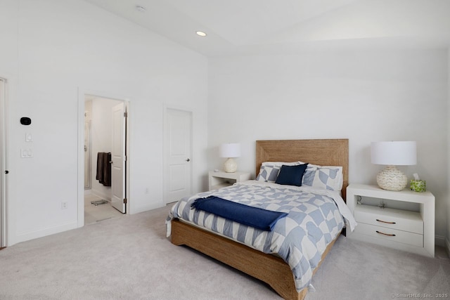 carpeted bedroom featuring high vaulted ceiling