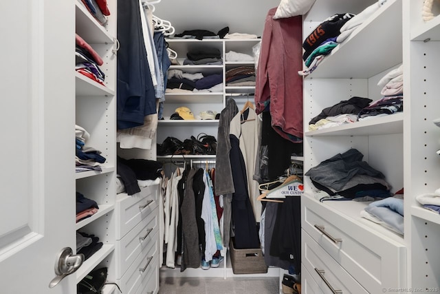 spacious closet featuring tile patterned flooring