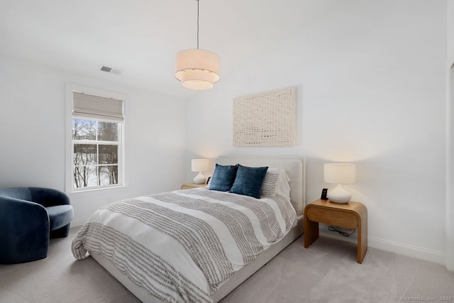 bedroom featuring light colored carpet