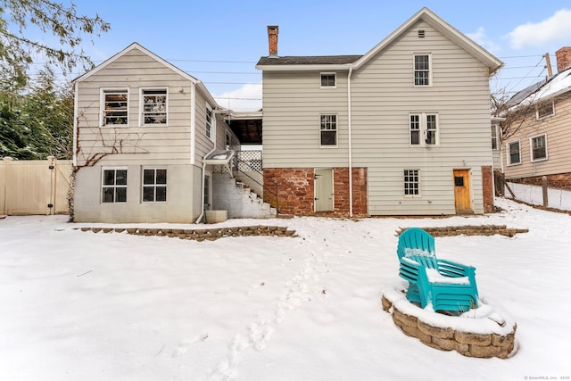 view of snow covered house