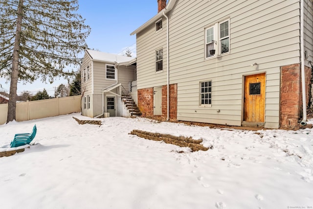 view of snow covered house