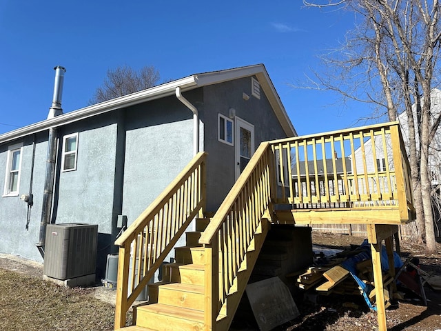 exterior space featuring a wooden deck and cooling unit