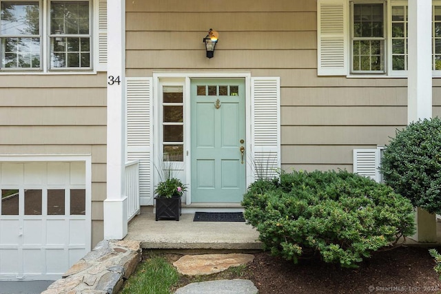 property entrance featuring a garage