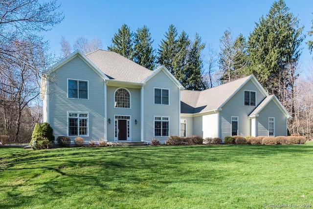 colonial-style house with a front lawn