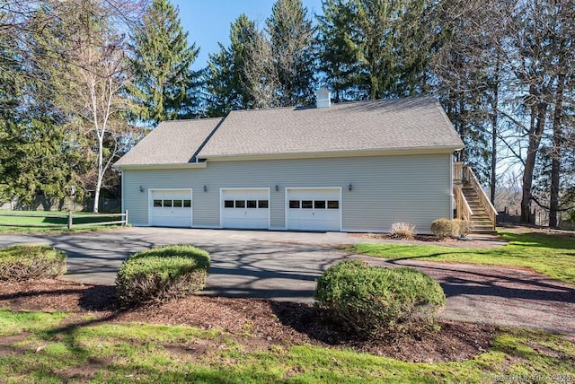 view of property exterior with a garage