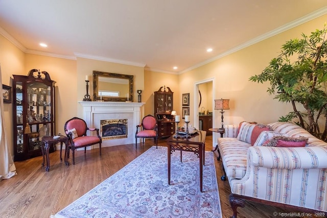 living room featuring ornamental molding and wood-type flooring