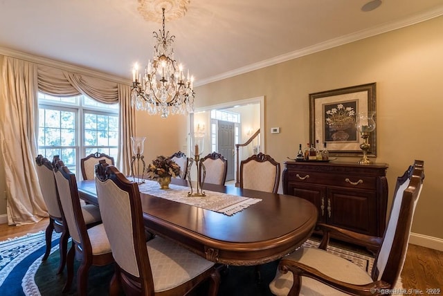 dining room featuring crown molding, a notable chandelier, and dark hardwood / wood-style flooring