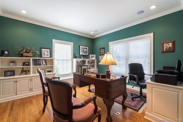 office area featuring ornamental molding, plenty of natural light, and light hardwood / wood-style floors