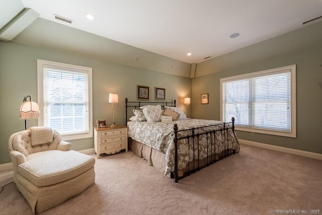 bedroom featuring light carpet