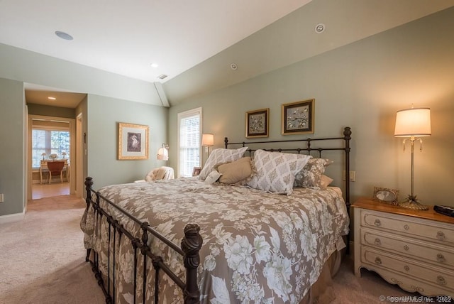 carpeted bedroom featuring lofted ceiling