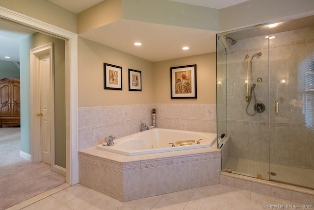 bathroom featuring independent shower and bath and tile patterned floors