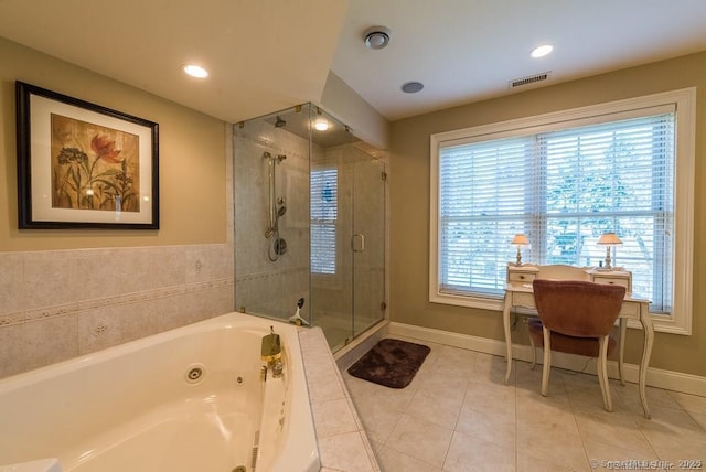 bathroom featuring tile patterned flooring and separate shower and tub