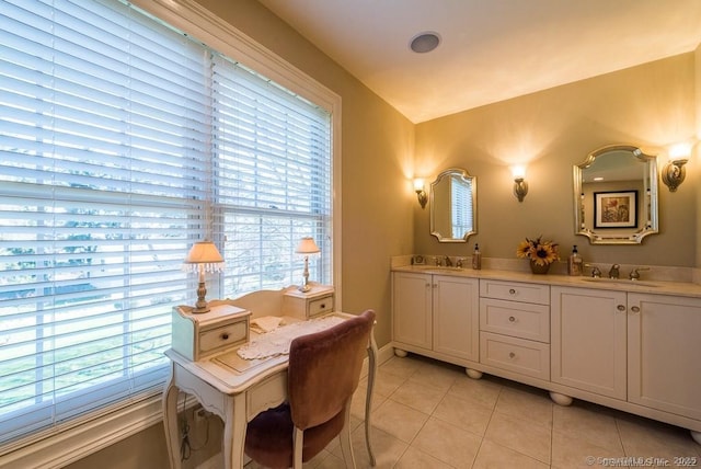 bathroom featuring a healthy amount of sunlight, tile patterned flooring, and vanity