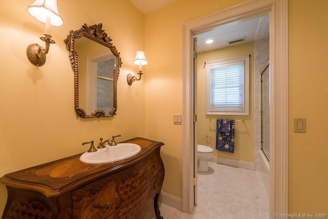 full bathroom with vanity, toilet, tile patterned flooring, and combined bath / shower with glass door