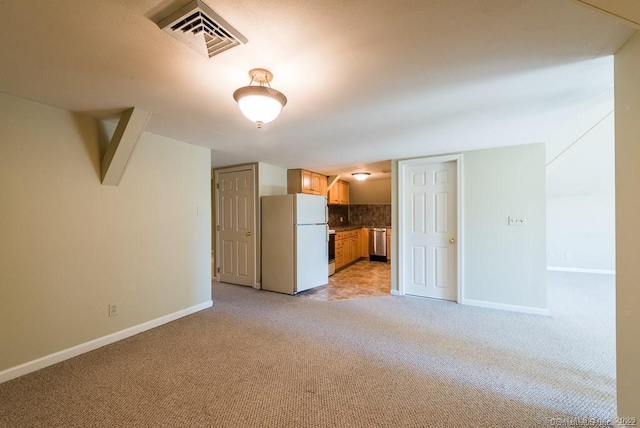 unfurnished living room with light colored carpet