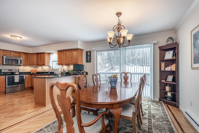 dining area featuring baseboards, a baseboard heating unit, a chandelier, and ornamental molding